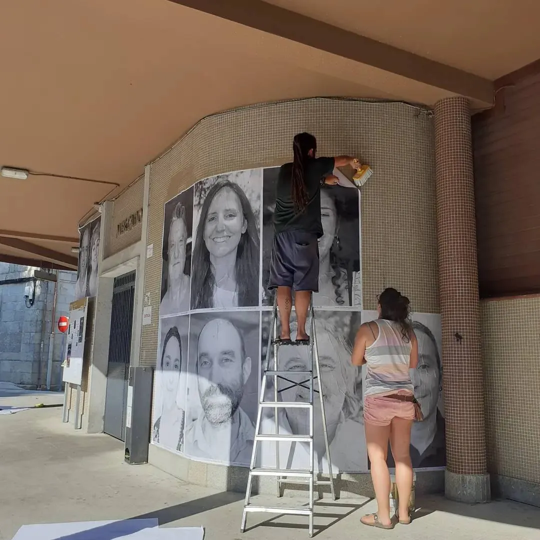 Rural Revival - Inside Out Project pasting the photos